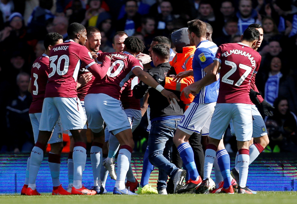 Aston Villa players react after a fan invades the pitch and attacks Jack Grealish during Birmingham City v Aston Villa at St Andrewu00e2u20acu2122s, Birmingham, Britain March 10, 2019. u00e2u20acu201d Action Images handout pic via Reuters 